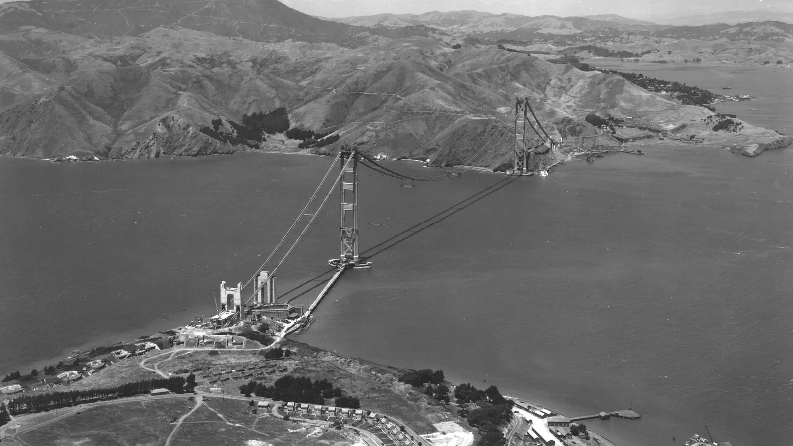 1936 aerial view of the Golden Gate Bridge under construction, cables strung between towers