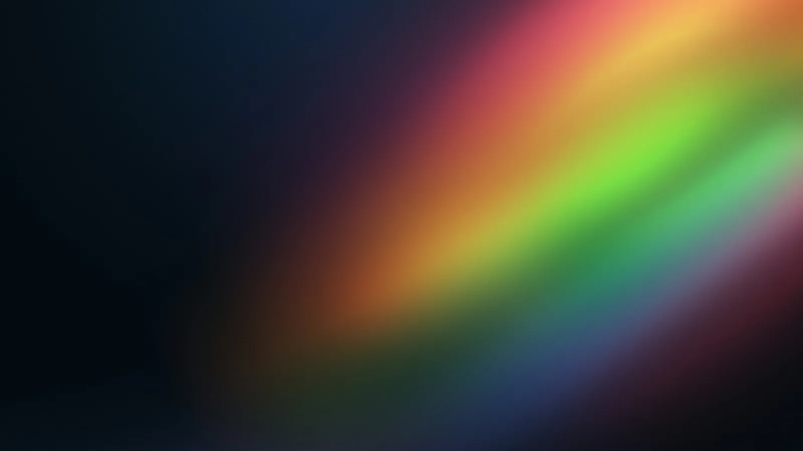 A band of rainbow light on a dark background