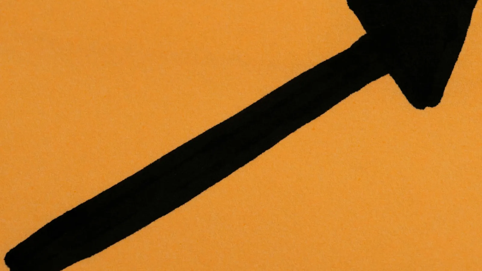 A bold black arrow drawn on an orange background