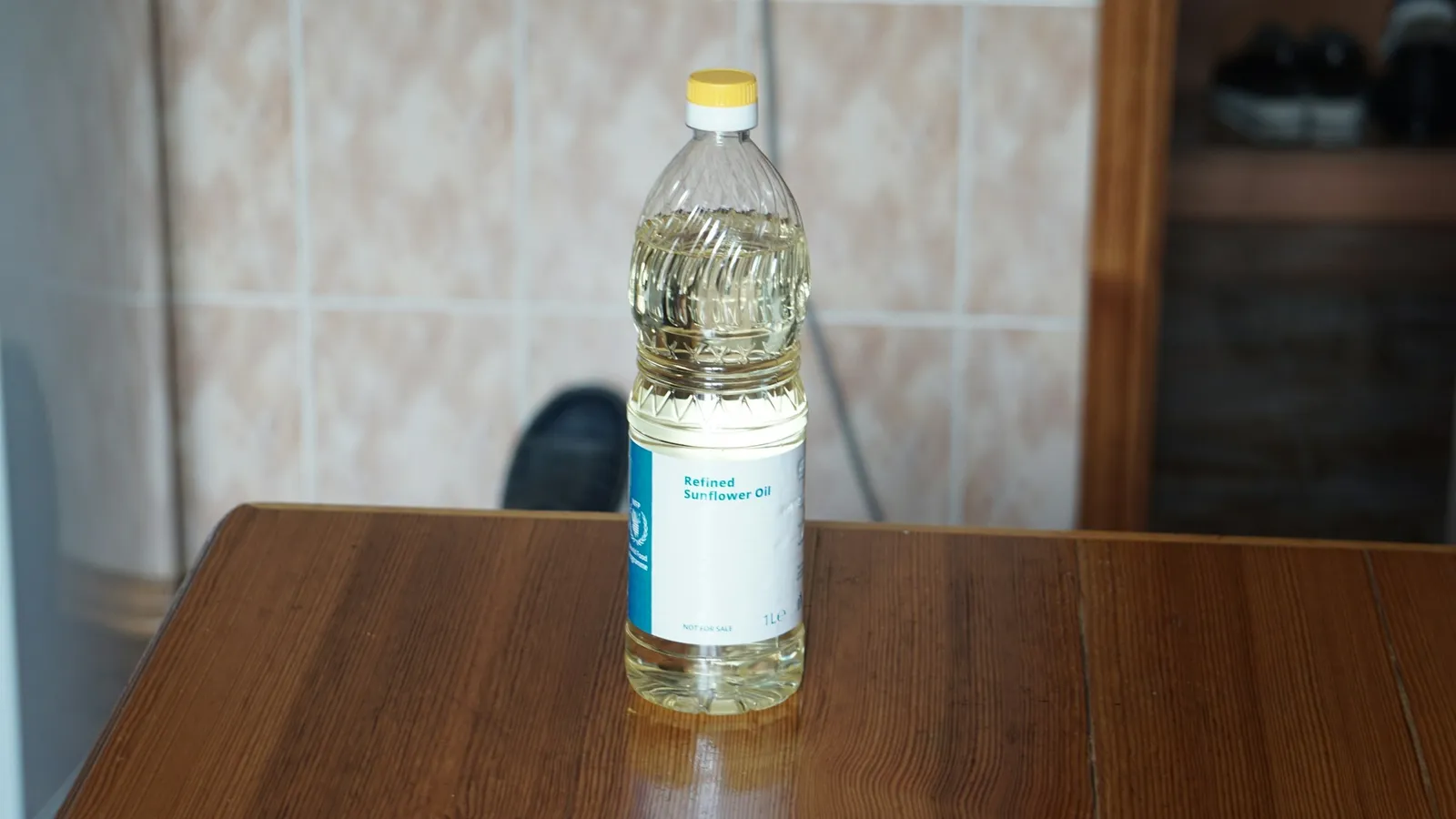 A bottle of cooking oil on a table