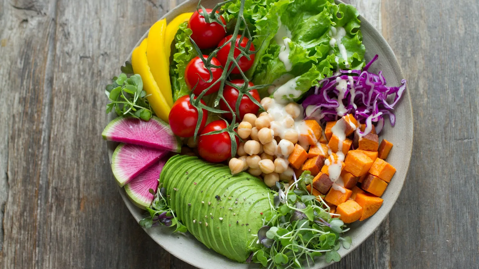 A bowl of vegetables, chickpeas and greens