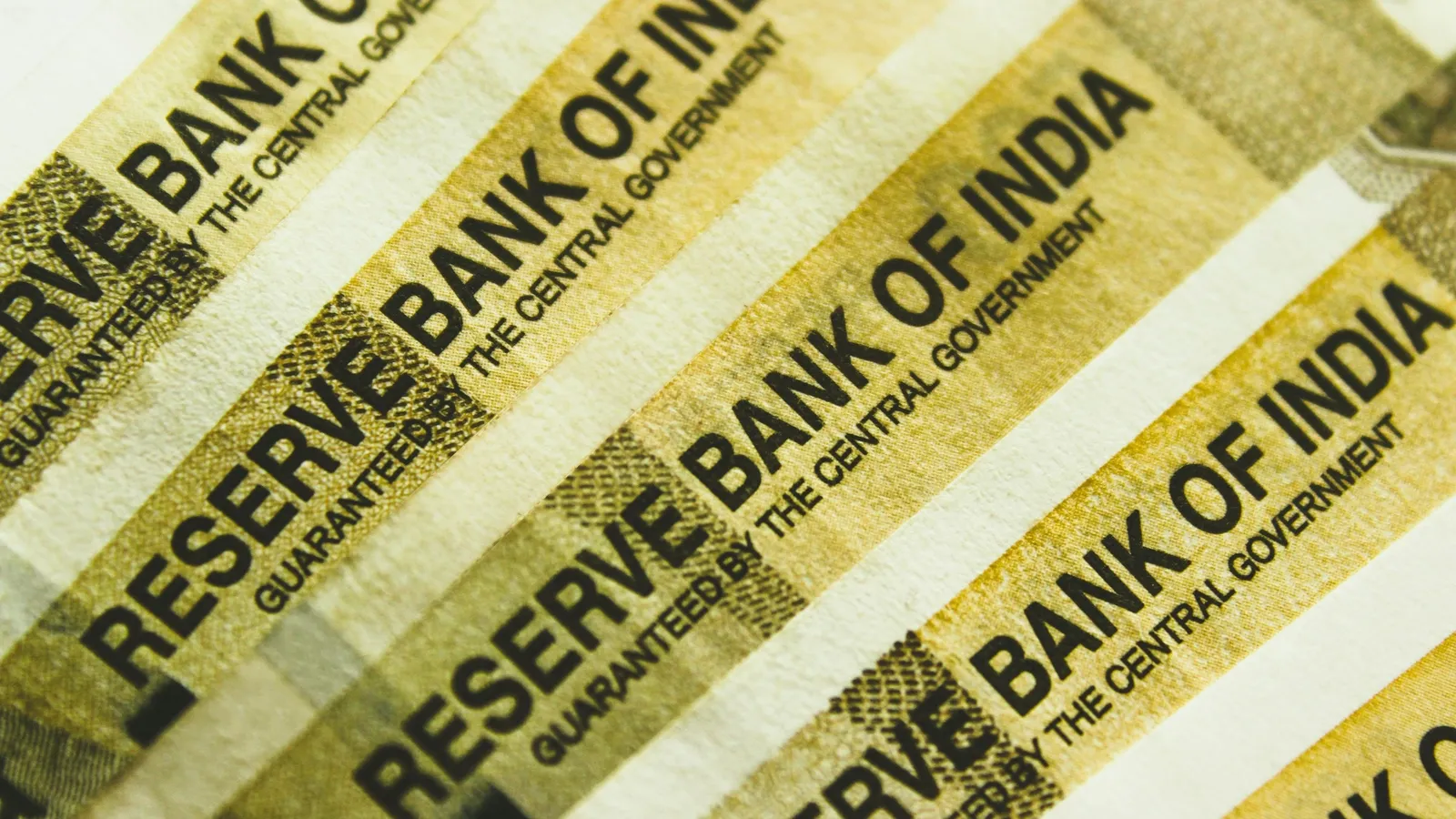 A bundle of Indian banknotes held by a paper band