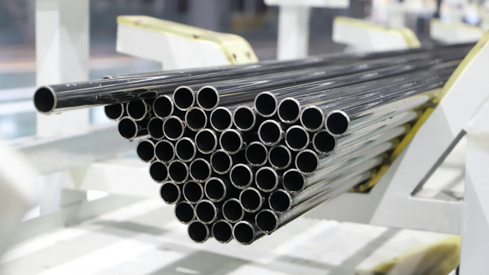 A bundle of steel tubes on a rack