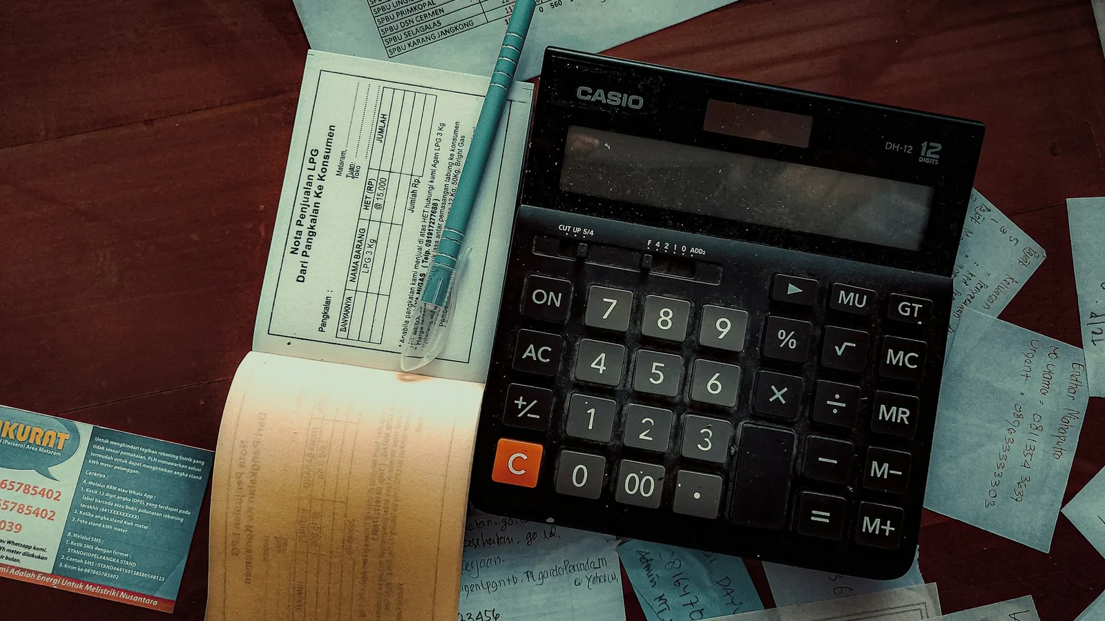 A calculator lying on handwritten maths notes