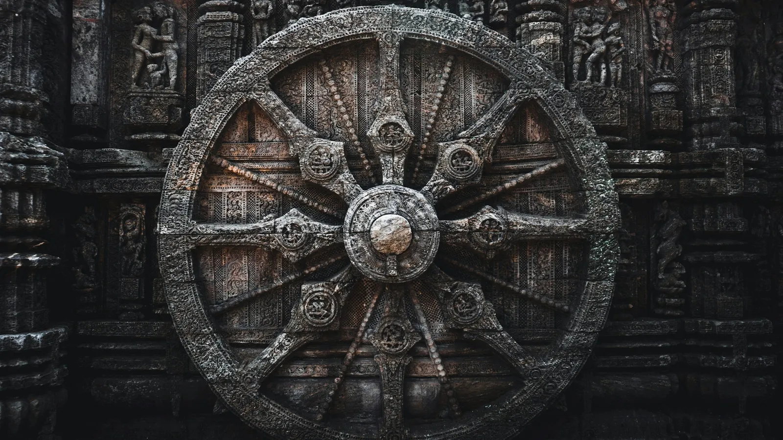 A carved stone chariot wheel at the Konark Sun Temple