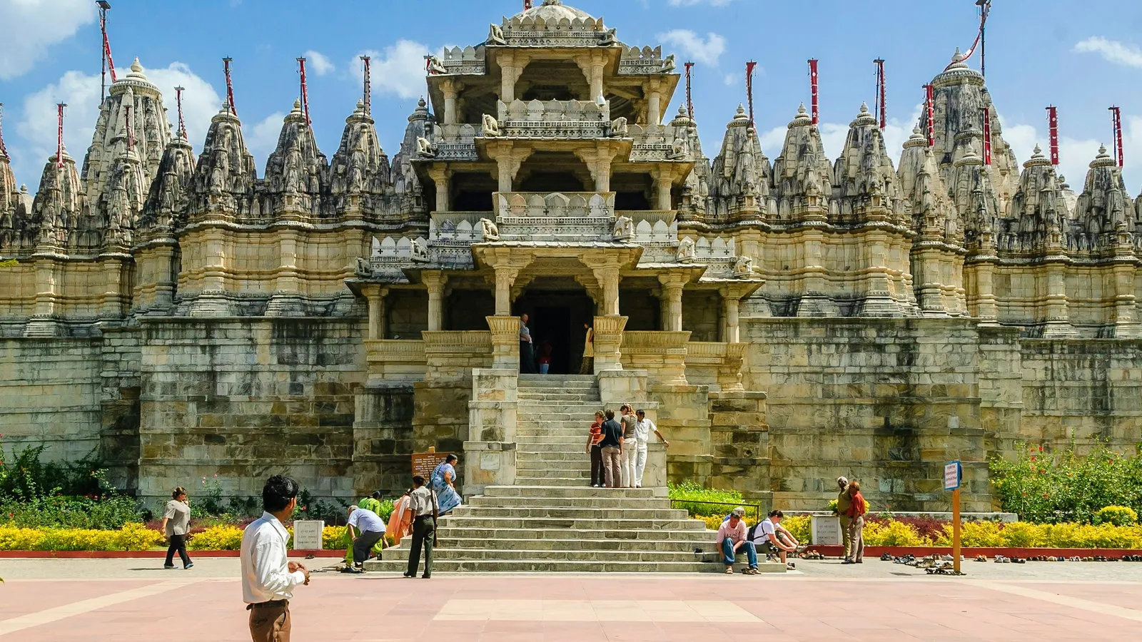 A carved stone Jain temple with many spires