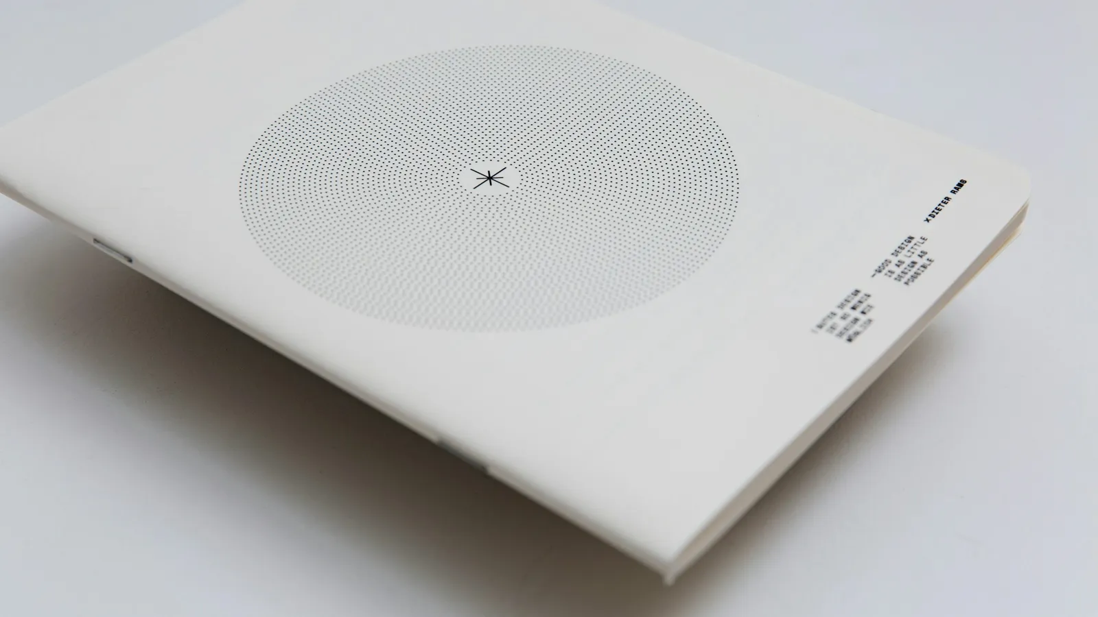 A circle printed on a white card notebook cover