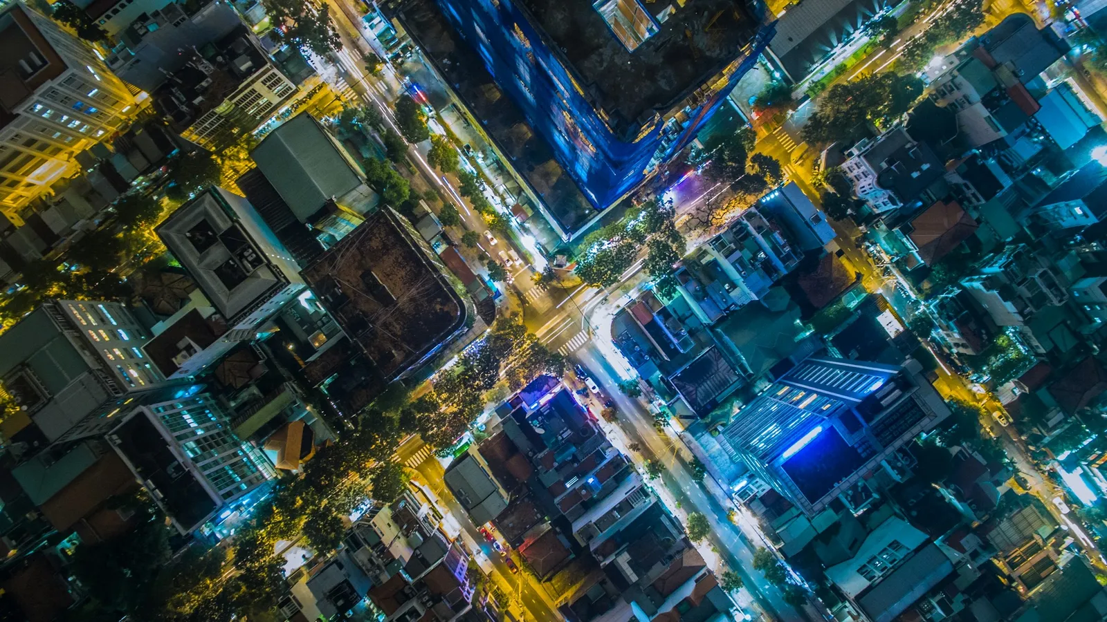 A city street grid seen from directly above at night