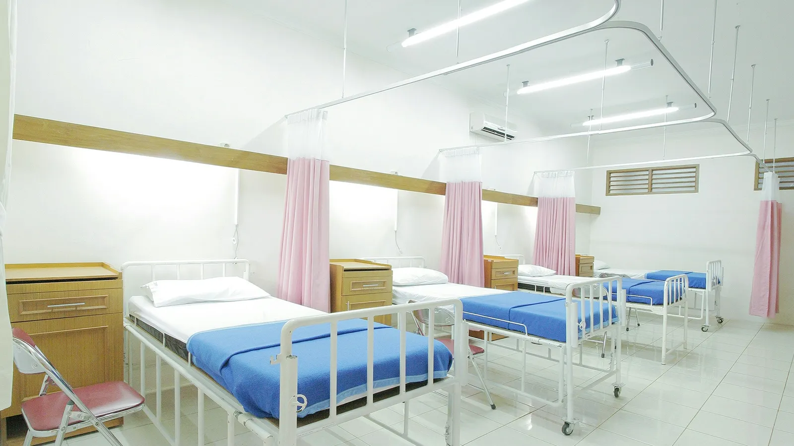A clean hospital ward with rows of beds