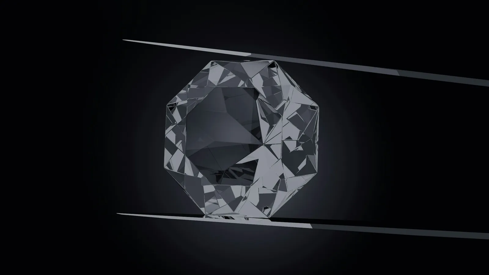 A clear diamond held in tweezers