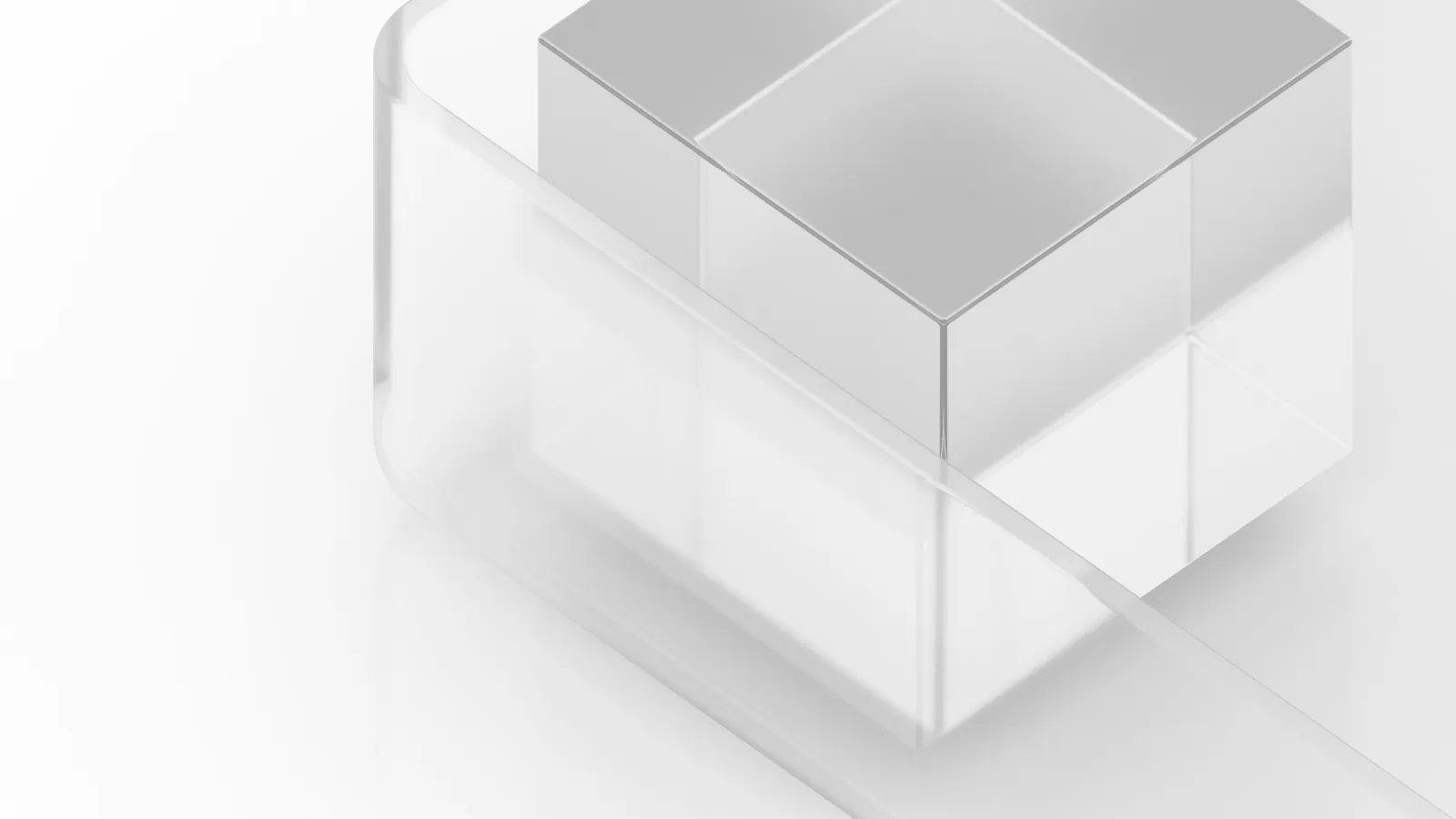 A clear glass cube on a white surface
