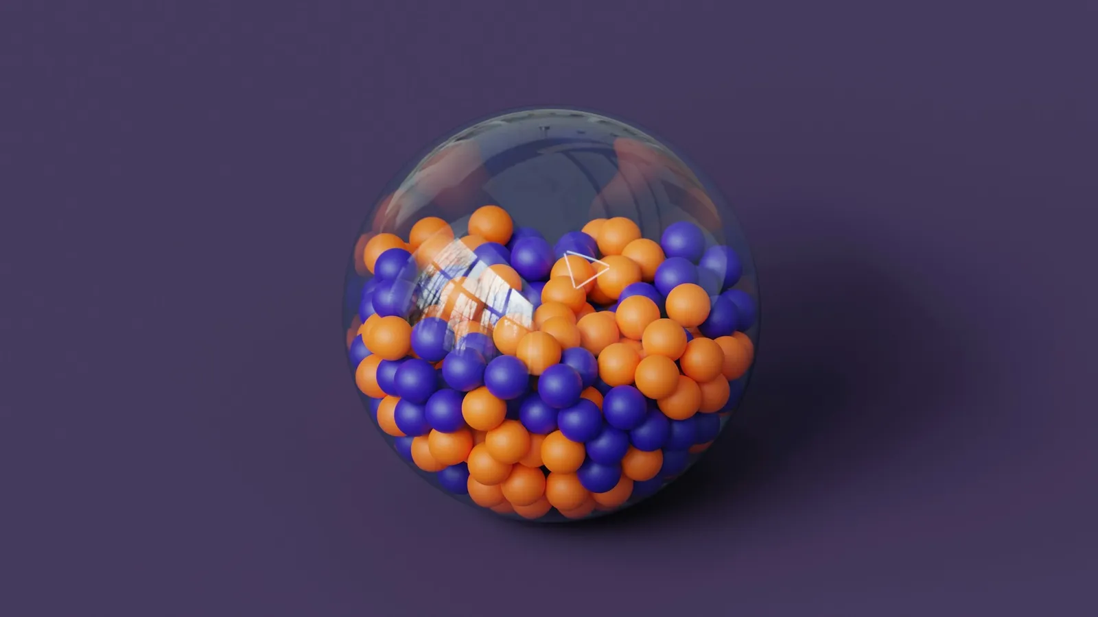 A clear sphere filled with orange and blue balls like a nucleus model