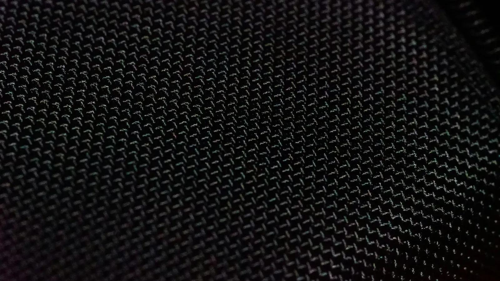 A close-up of a fine black woven mesh