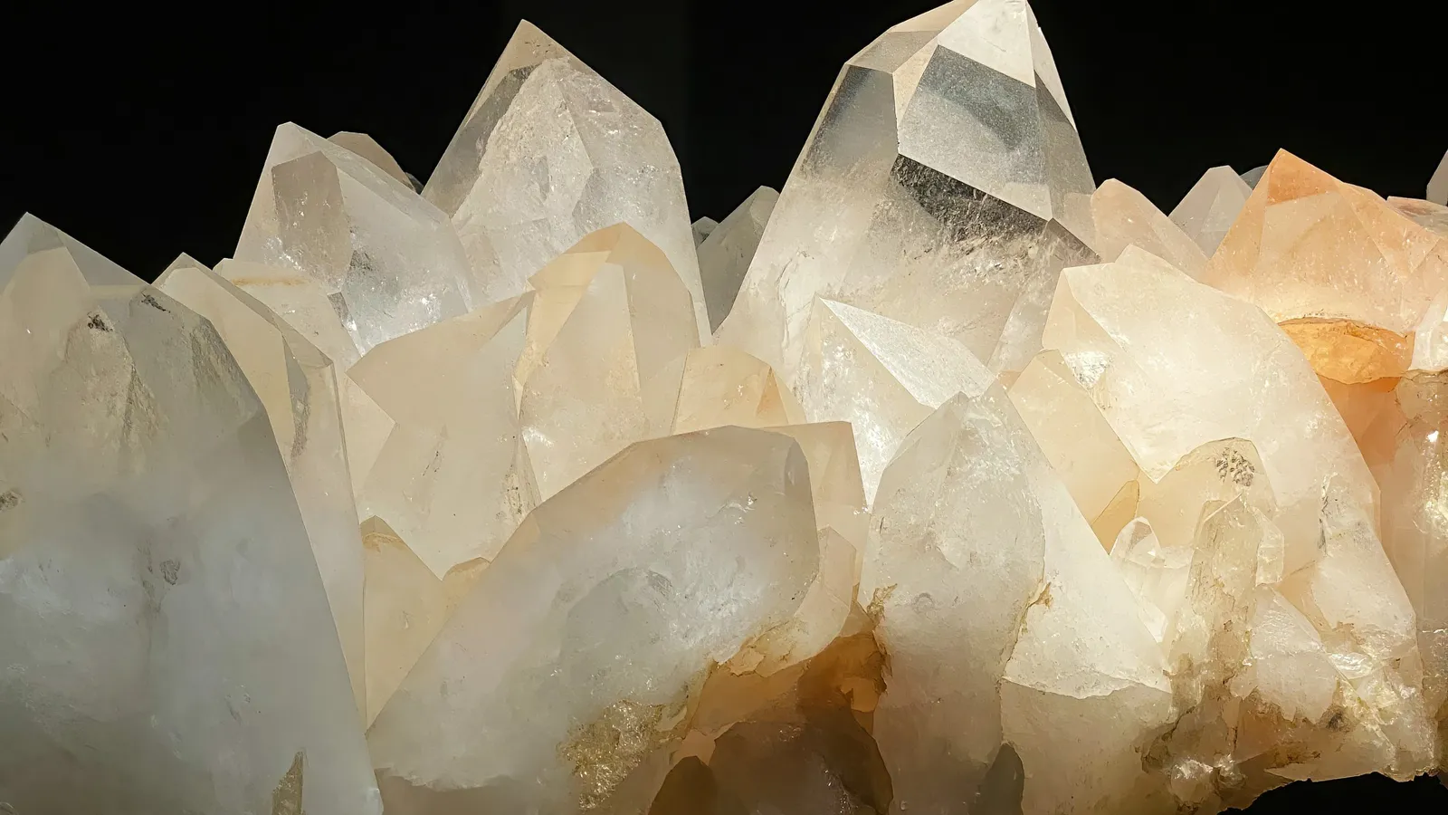 A cluster of clear quartz crystals, close up