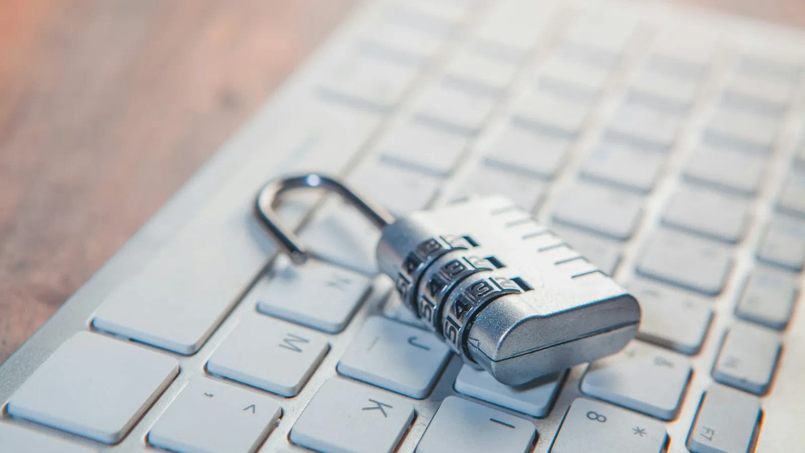 A combination padlock resting on a keyboard