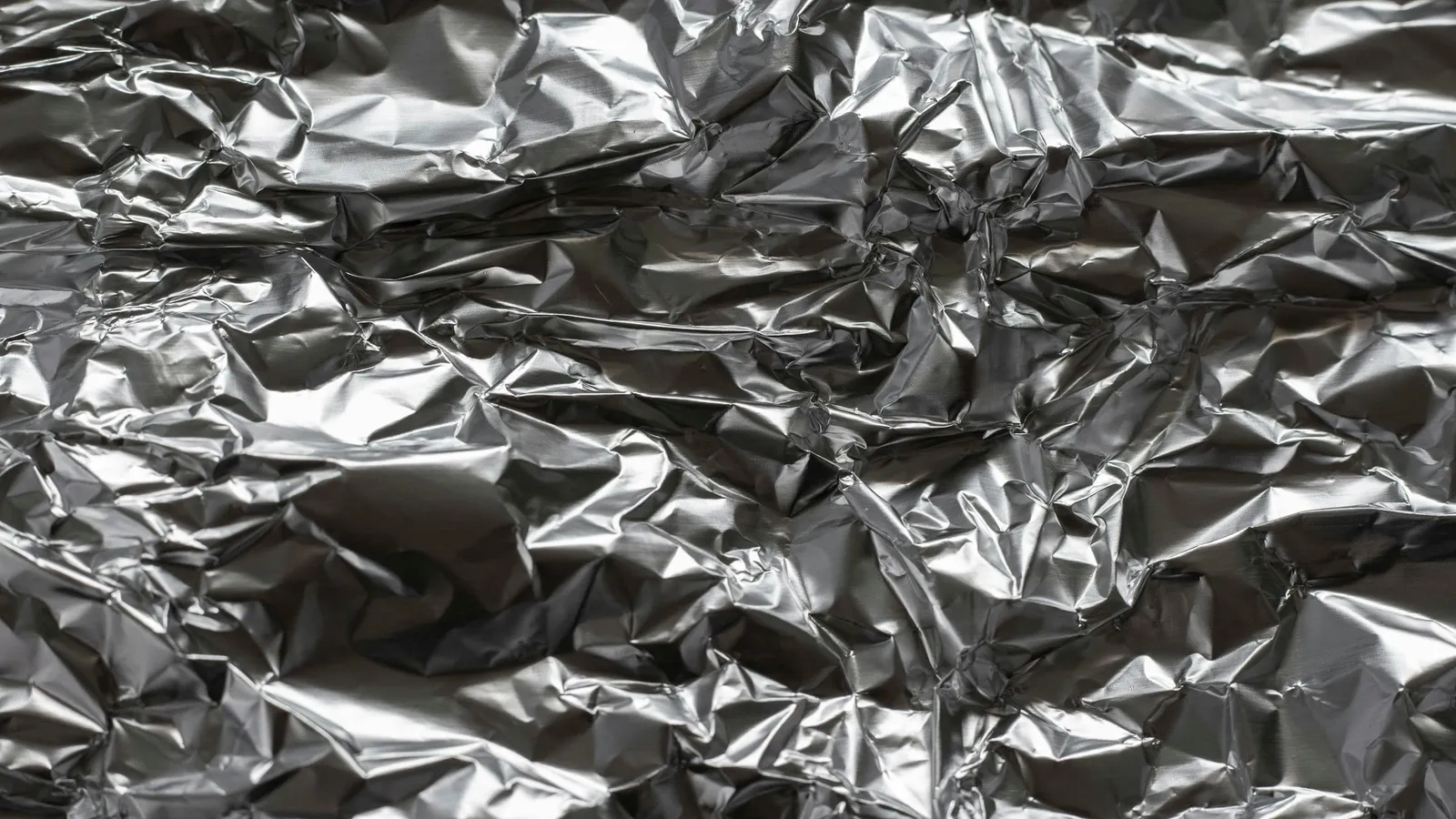 A crumpled sheet of silver metal foil
