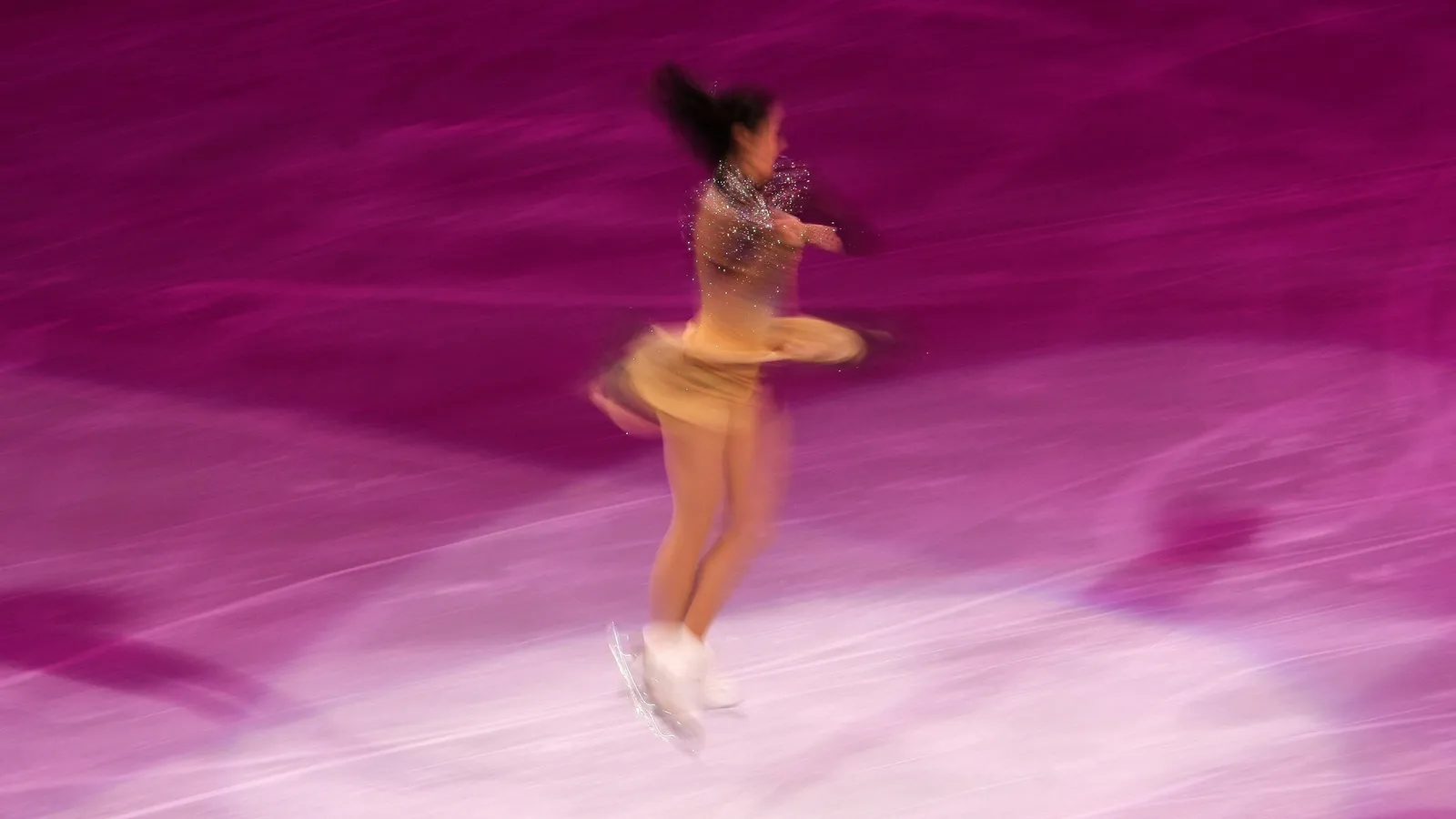 A figure skater spinning on the ice