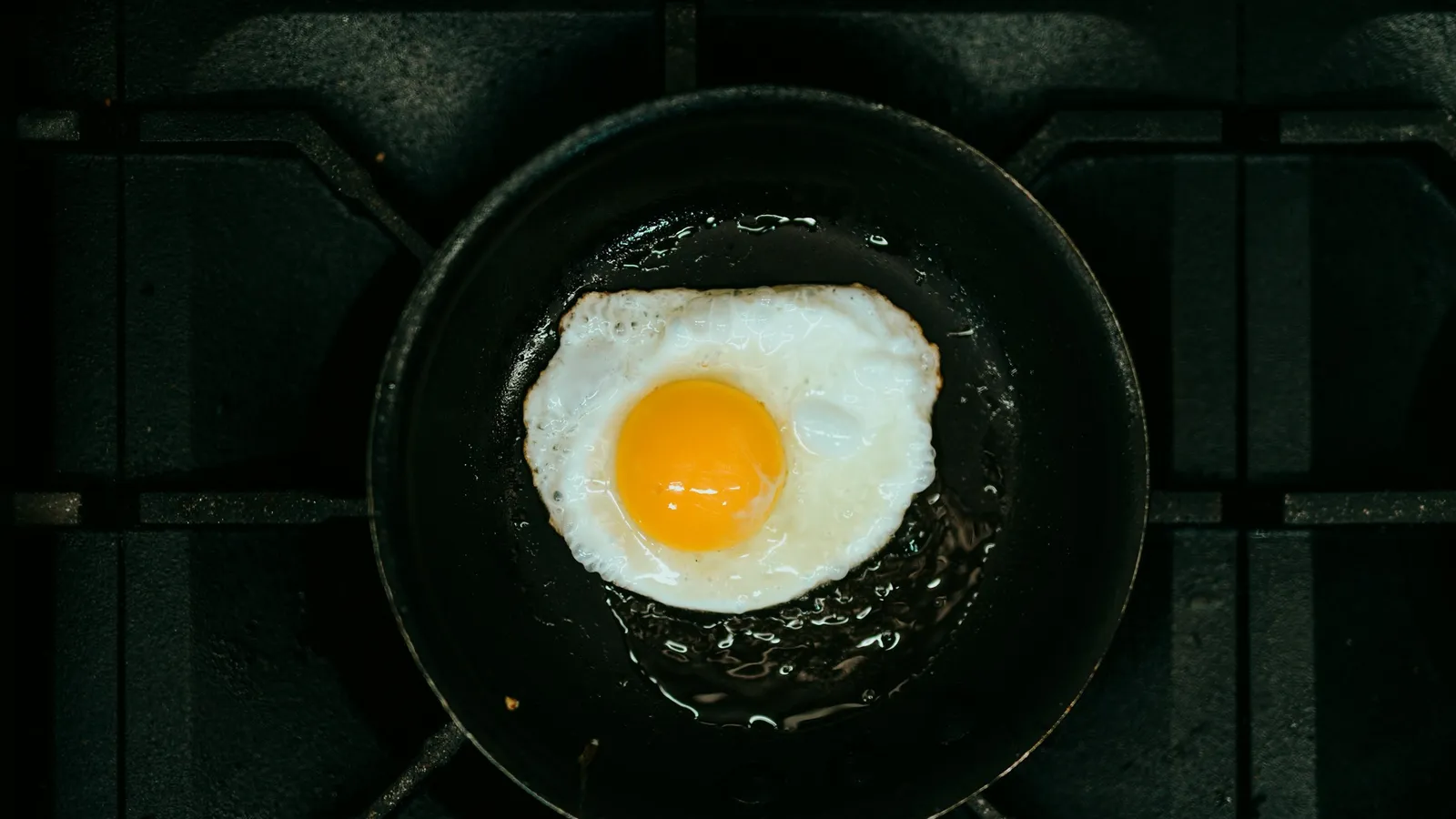 A fried egg in a non-stick pan