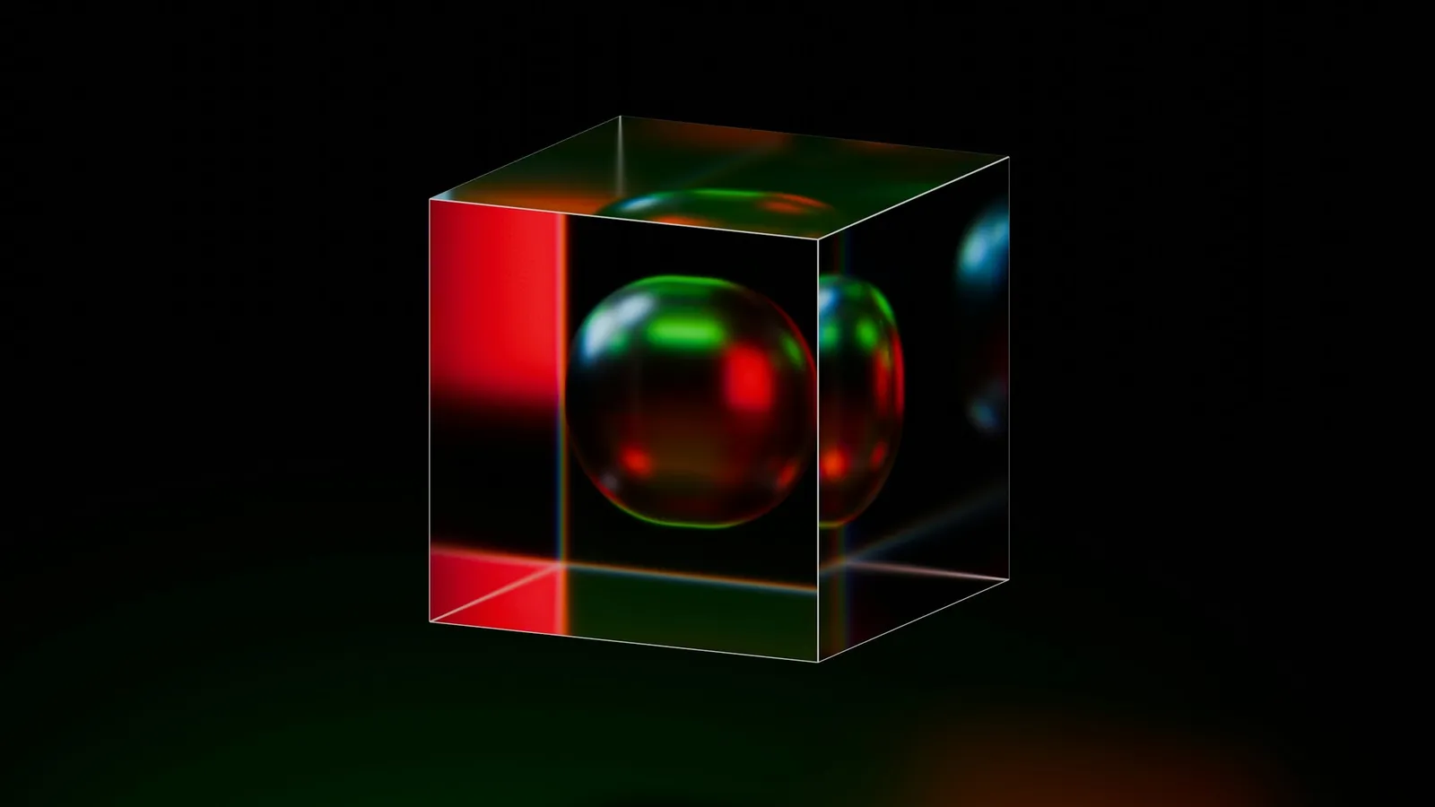 A glass cube glowing with red and green light
