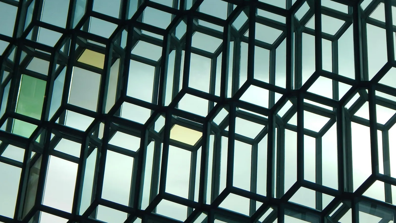 A glass facade built from repeating cube shapes