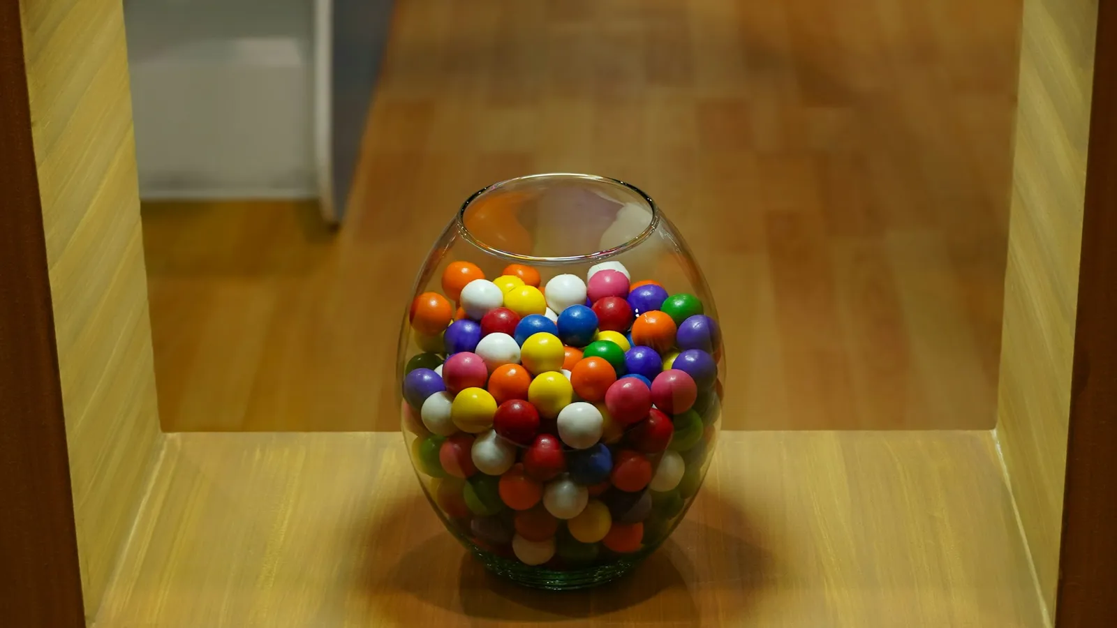 A glass jar full of coloured sweets