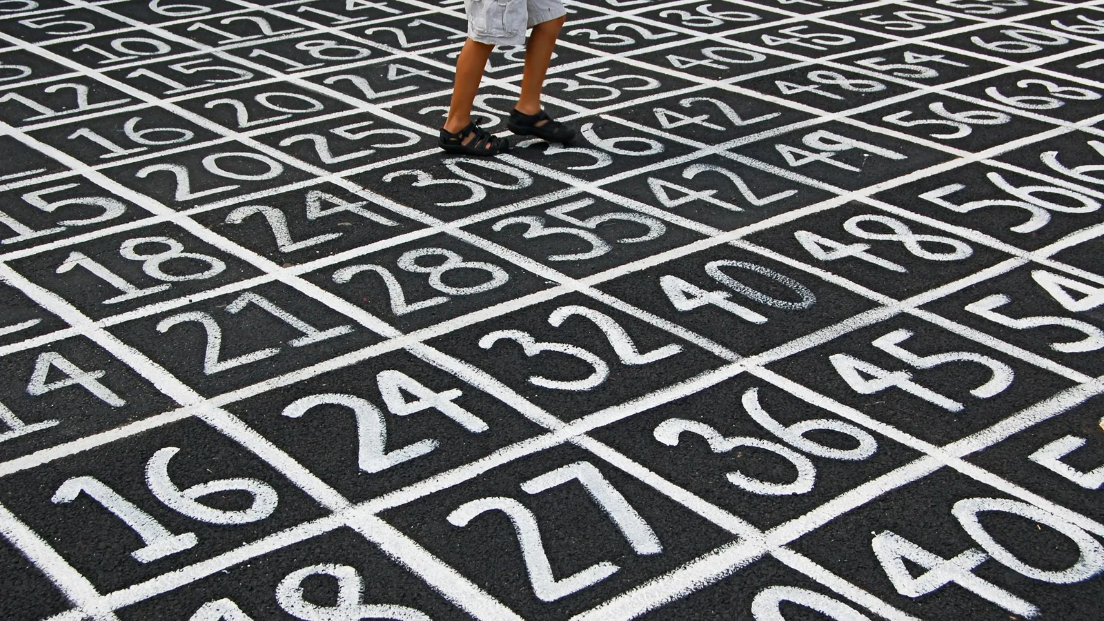 A grid of large painted numbers on the ground