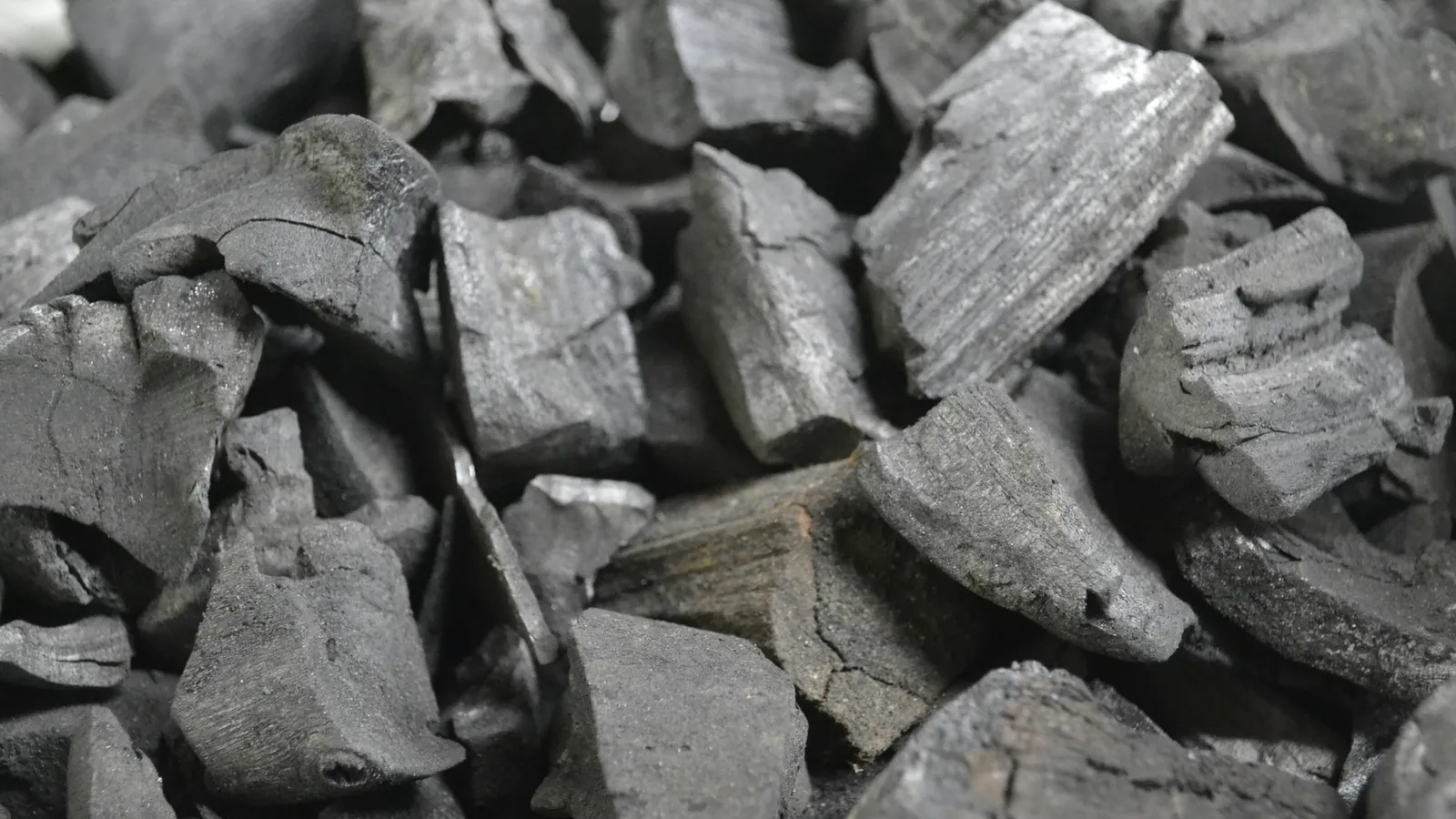A heap of black charcoal pieces