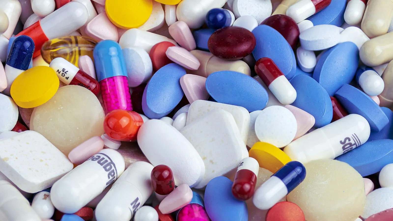 A heap of colourful tablets and capsules