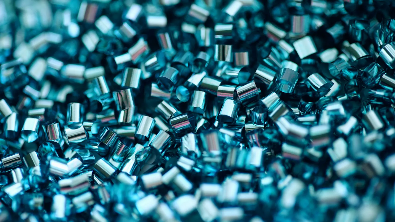 A heap of small clear blue plastic pellets