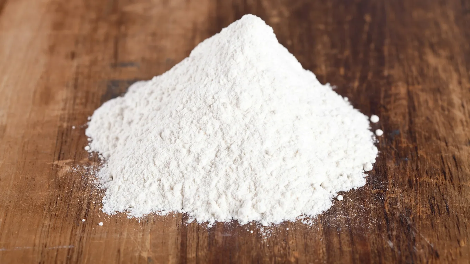 A heap of white powder on wood