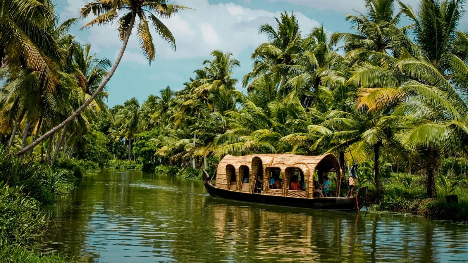 A houseboat on the palm-lined backwaters of Kerala