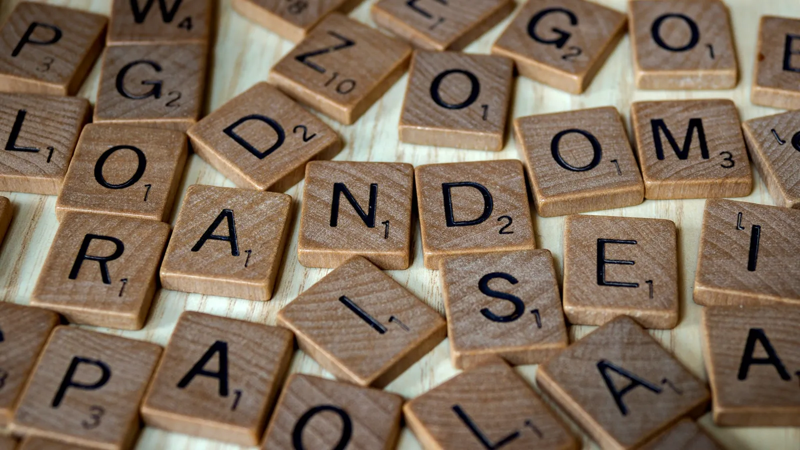 A jumble of wooden letter tiles