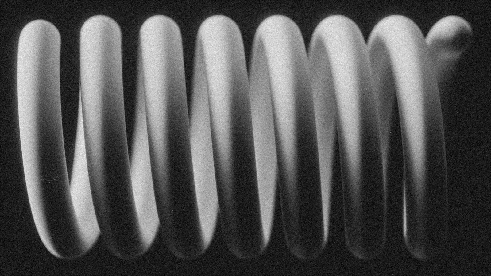 A large metal coil spring in black and white