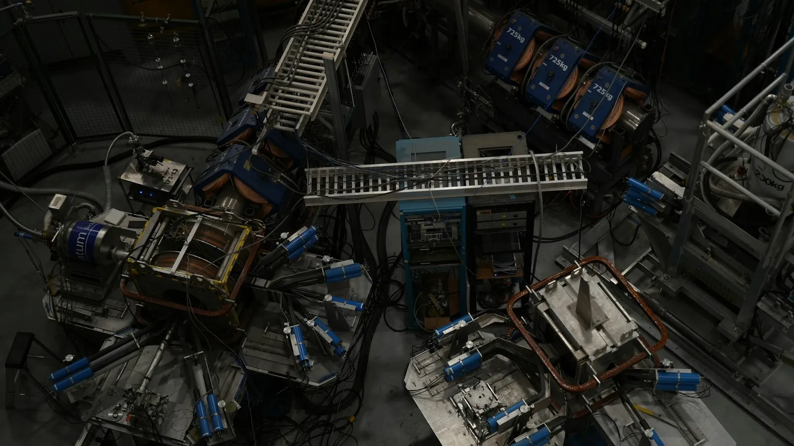 A large physics detector surrounded by cables