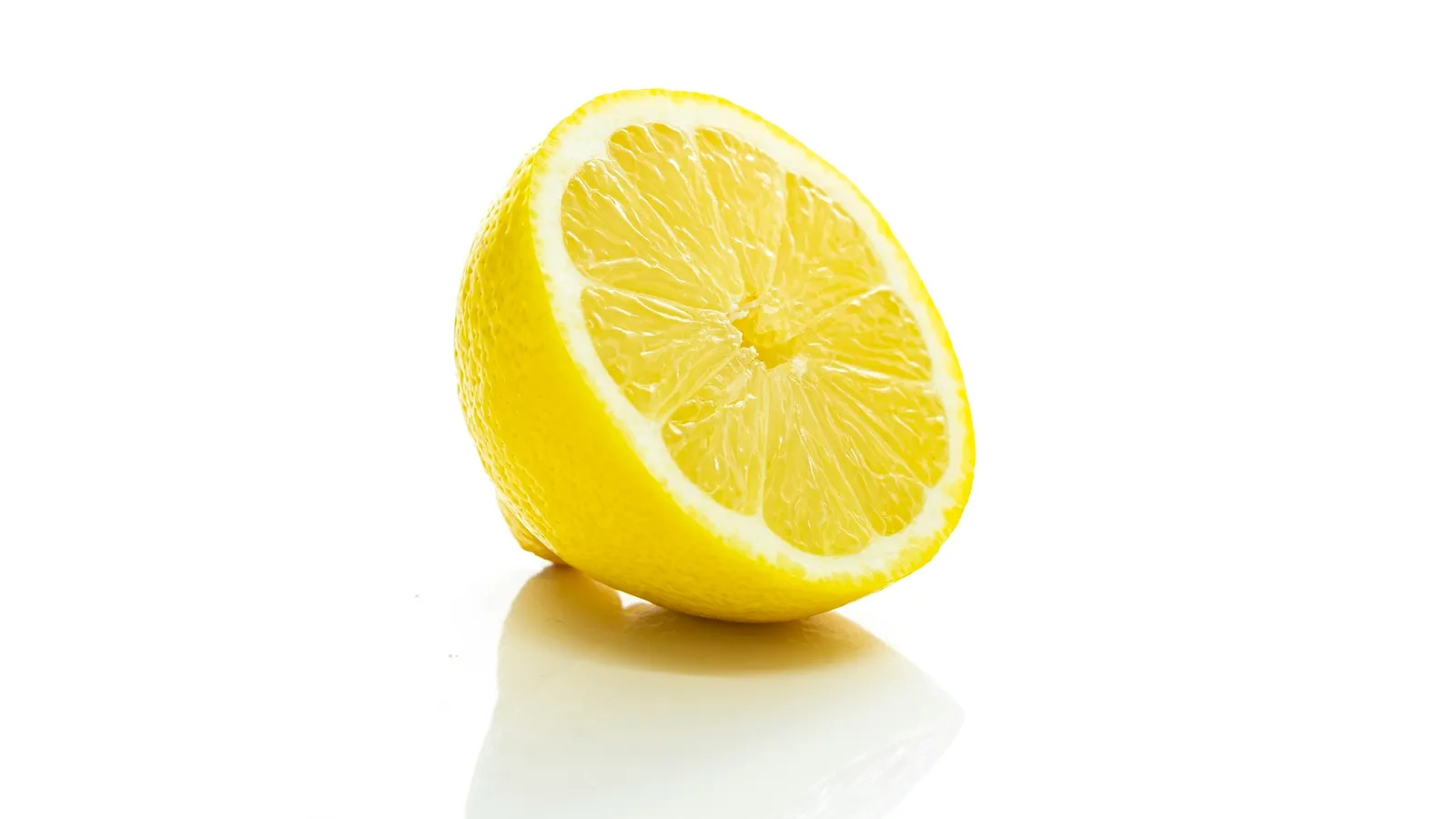 A lemon cut in half showing its segments