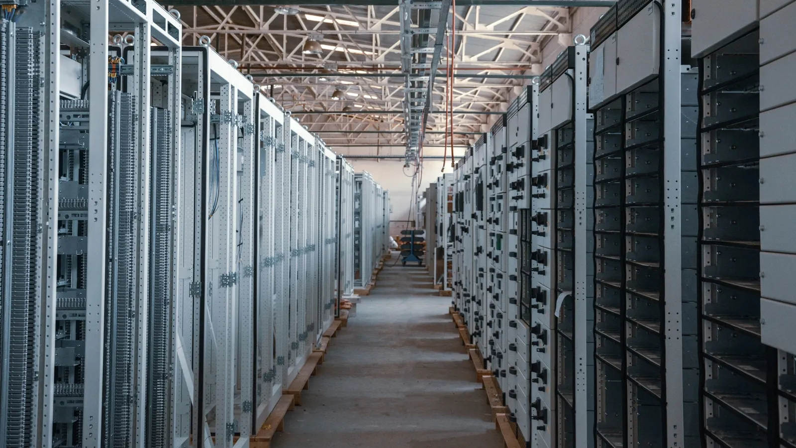 A long corridor between rows of server racks