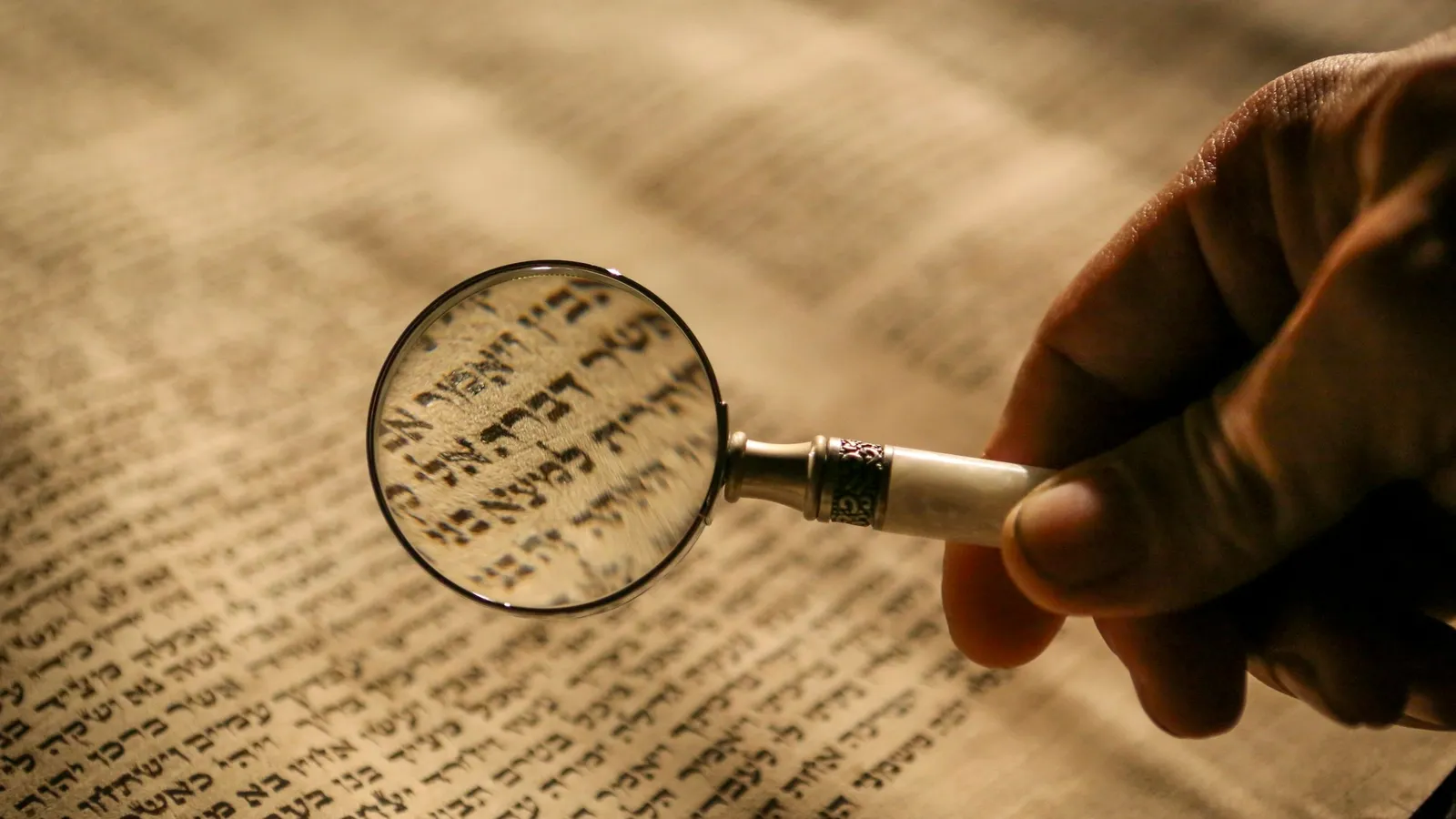 A magnifying glass held over a printed page