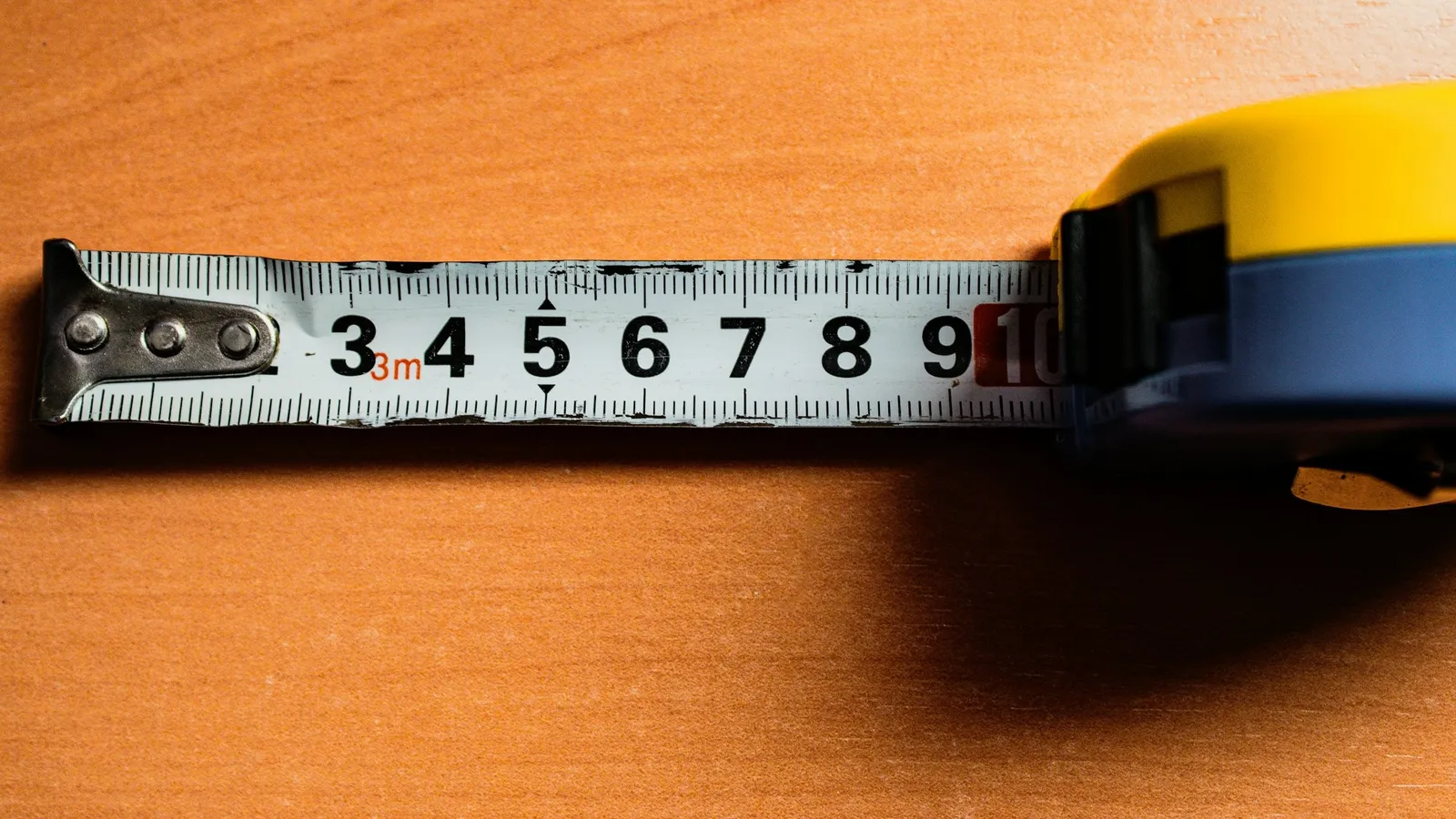 A measuring tape stretched out with numbers