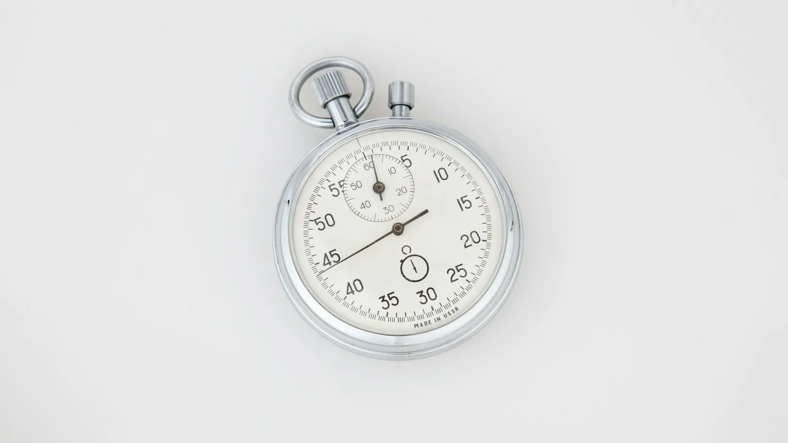 A mechanical stopwatch on a white background
