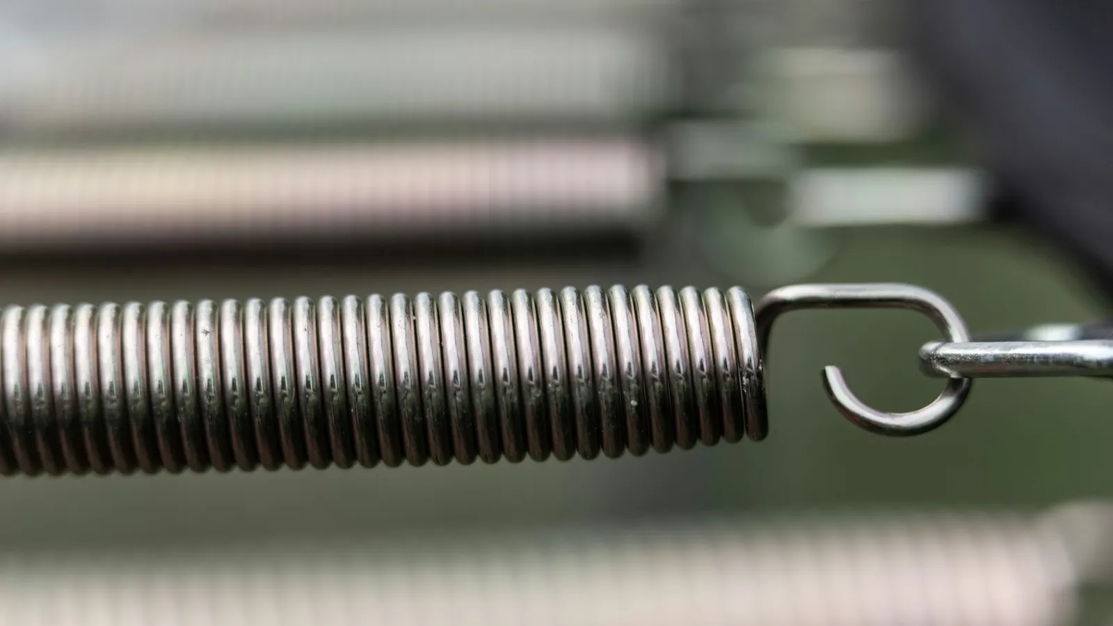 A metal extension spring with a hook at its end