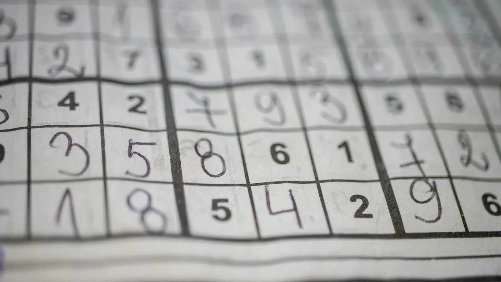 A number puzzle grid filled in by hand