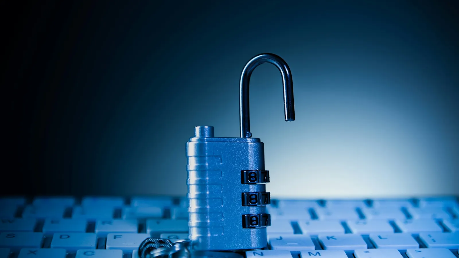 A padlock resting on a computer keyboard