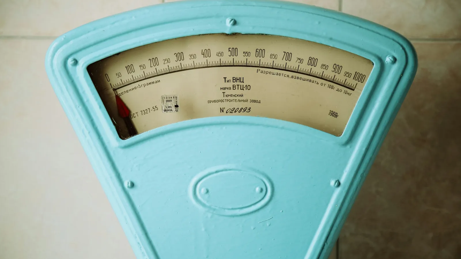 A pale blue vintage weighing scale