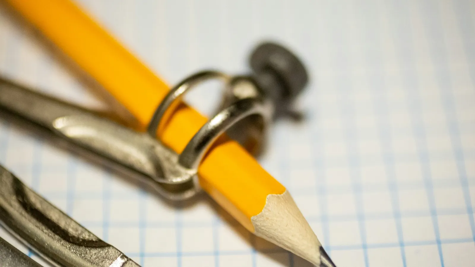A pencil and compass on graph paper