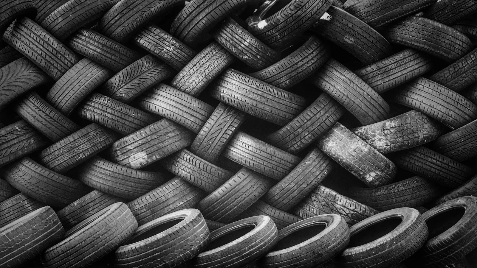 A pile of black rubber tyres