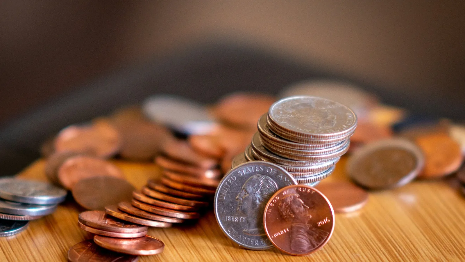 A pile of copper and silver coins on a table