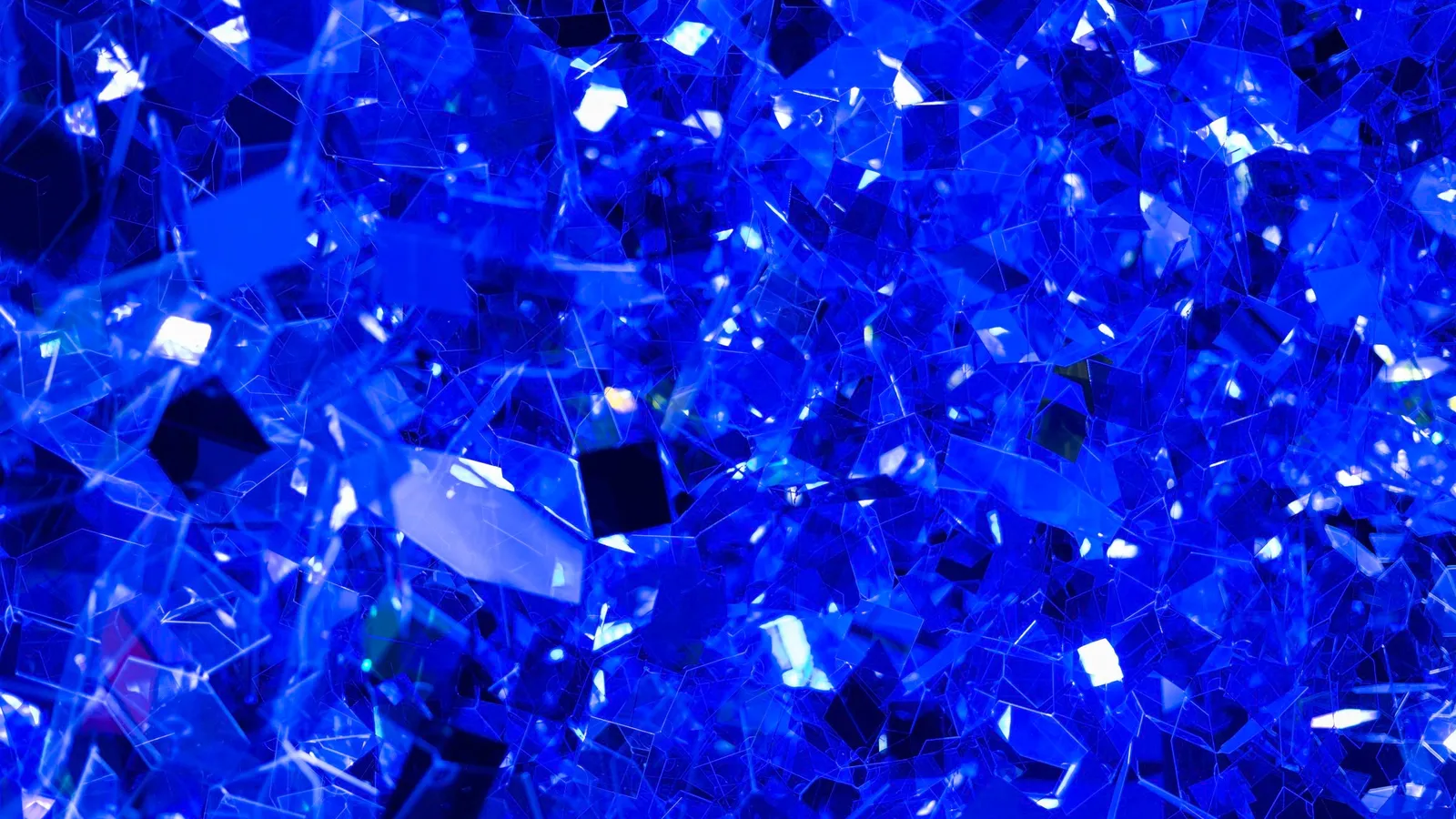 A pile of deep blue crystals, close up