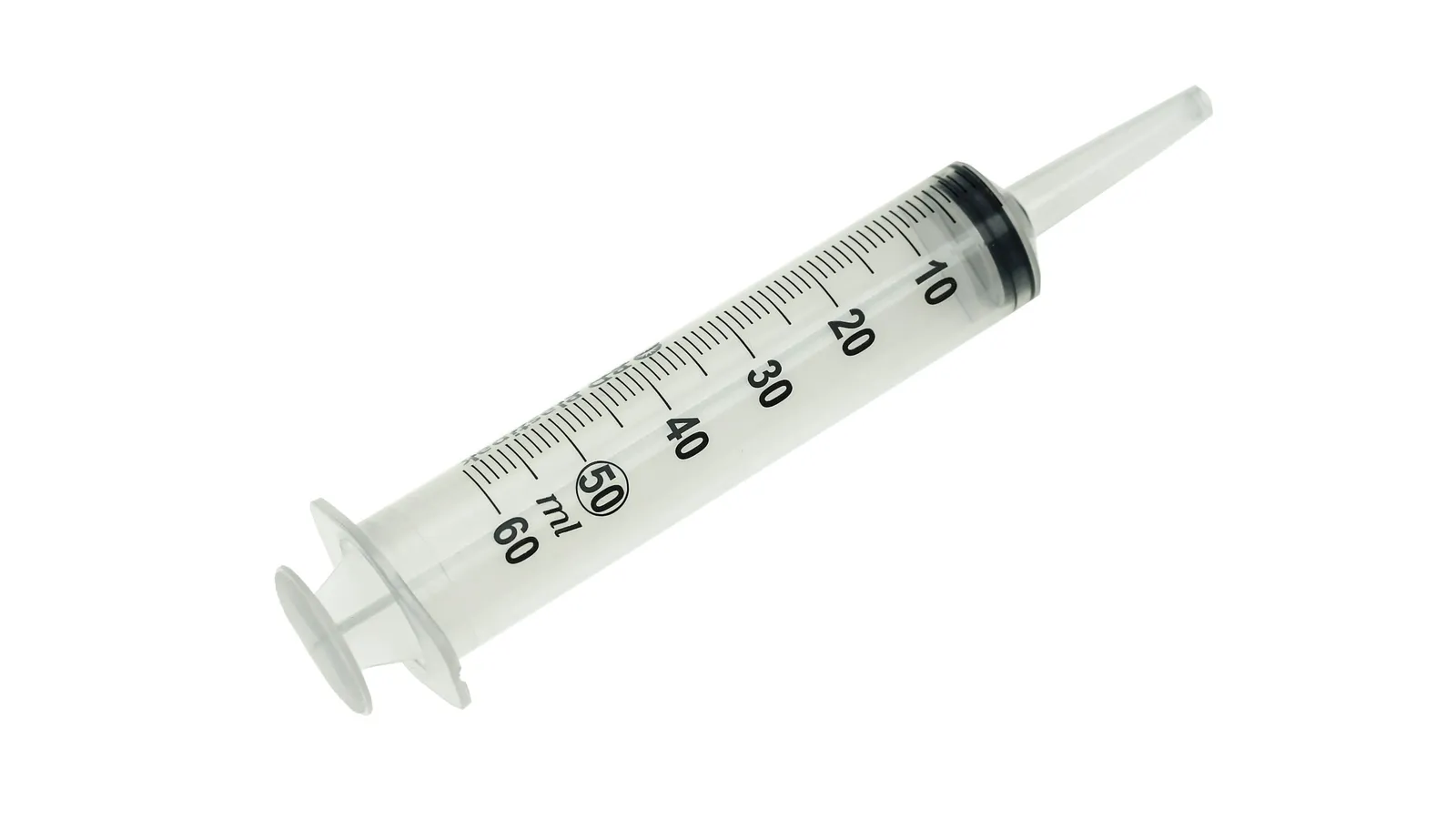 A plastic syringe with its plunger, on white