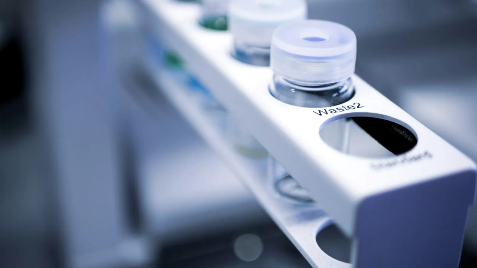 A rack of small sample vials in a lab