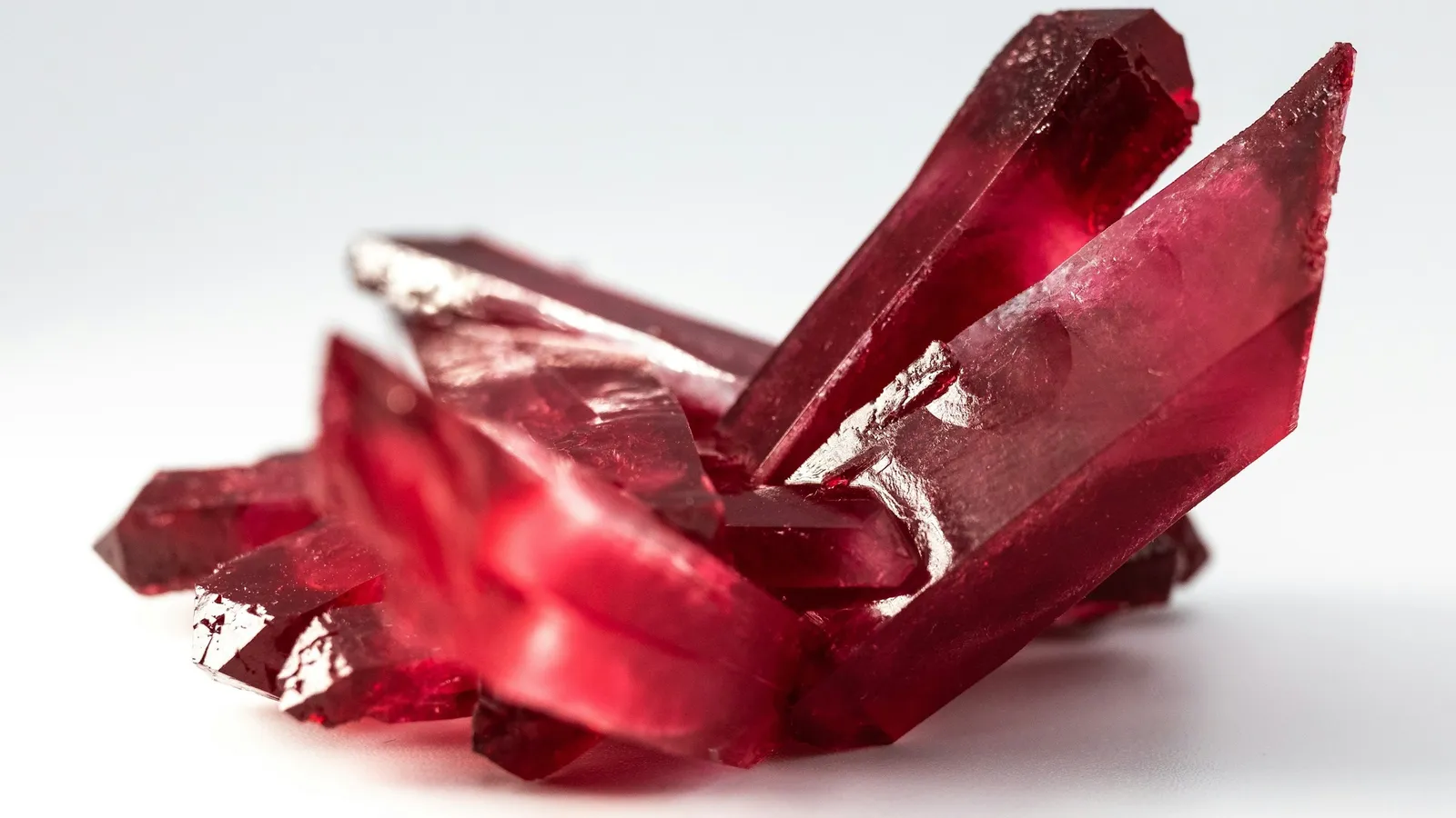 A red crystal on a white background